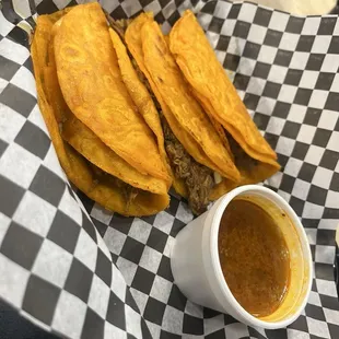 Signature Barbacoa dipping tacos.  ¡Tan Delicioso!