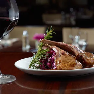 a plate of food and a glass of wine