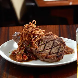 a plate of food and a glass of beer