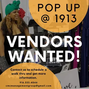 a woman standing in front of a vendor's wanted sign