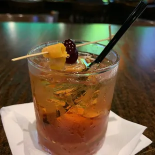 a drink with a garnish on the top