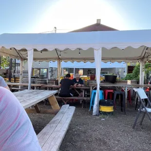 a man sitting at a picnic table