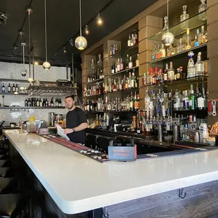 a bartender behind the bar