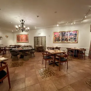 a dining room with tables and chairs