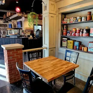 a table and chairs in a coffee shop