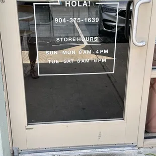 Front door- store hours of operation and phone #