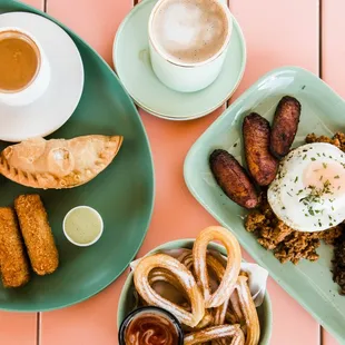 a plate of food and a cup of coffee