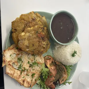 Rice dish with pollo a la plancha, black beans and tostones. Delicious!