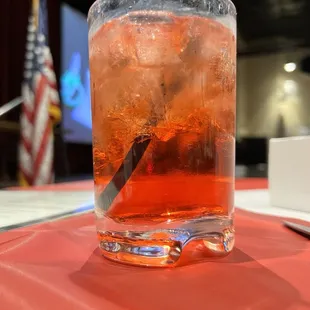 a close up of a drink with a straw in it