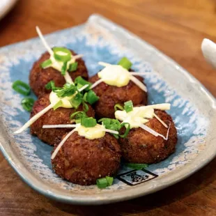 Colonial Crab Cake - blue crab meat, Thai basil aioli, baby lettuce, atchara