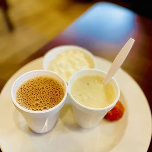 two cups of coffee on a plate