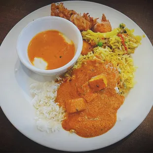 Weekday Adult Lunch Buffet Tomato chutney, curd rice, poriyal, onion pakora, Mysore bonda, white rice, and paneer butter masala