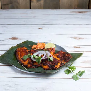 a plate of food on a wooden table