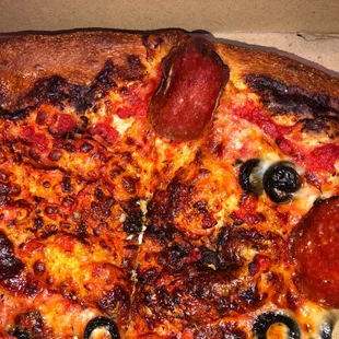 Overcooked, burnt and areas of no toppings