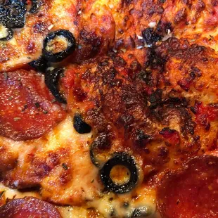 Overcooked, burnt and areas of no toppings