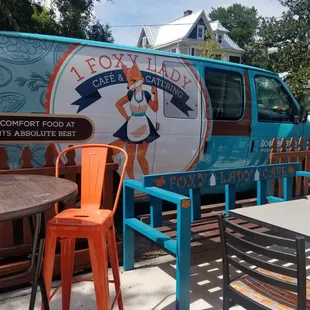 a food truck parked in front of a restaurant
