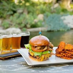 a burger and beer on a table