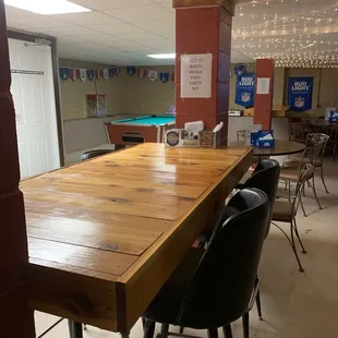 a pool table and chairs