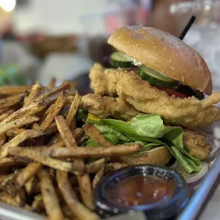 a burger and fries on a tray
