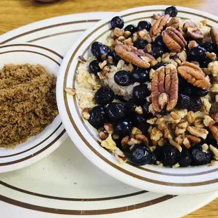 Oatmeal with blueberries and nuts with a side of brown sugar