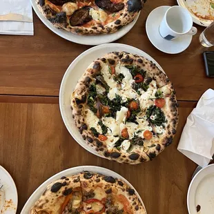 two pizzas on plates