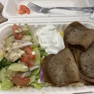 Lamb rice bowl with Greek house salad and tzatziki sauce