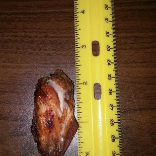 a piece of meat and a ruler