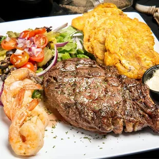 Cowboy Ribeye 22oZ , Jumbo Shrimps , Fried plantains