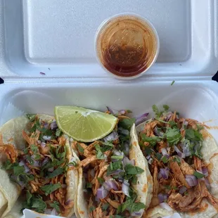 a chicken taco in a styrofoam container