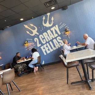 people eating at tables in a restaurant