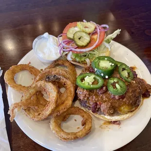 How can you resist homemade onion rings and homemade chili on the burger?