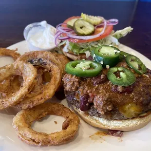 Chili cheeseburger and onion rings.