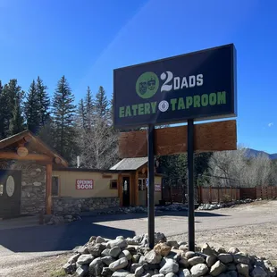 a sign in front of a restaurant