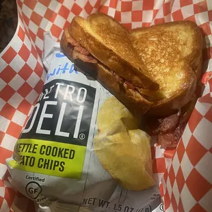 a sandwich and potato chips