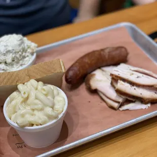 2 meat   Turkey  Spicy sausage  Mac n cheese  Potato salad