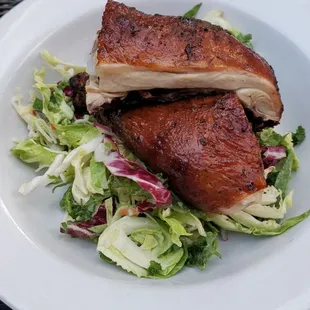 Jerk Chicken over a bed of kale salad