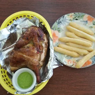 Peruvian rotisserie chicken, aji sauce and yucca fries. Great place, the food is delicious!