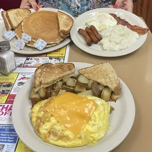 Grits, sausage, bacon, egg, pancake, white toast. Biscuit gravy, egg cheese, fried potatoes.