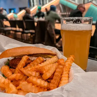 a sandwich and a glass of beer