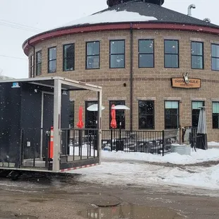 a trailer parked in front of a building