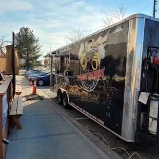 a food truck parked on the side of the road