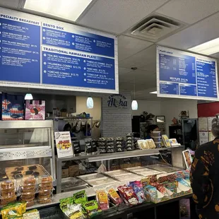 a woman standing in front of a counter