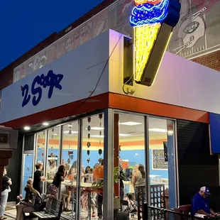 a large ice cream shop at night