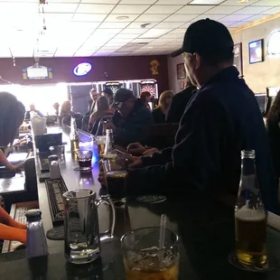 people sitting at the bar