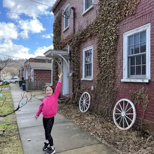 My daughter as we walk towards the side entrance of the bakery