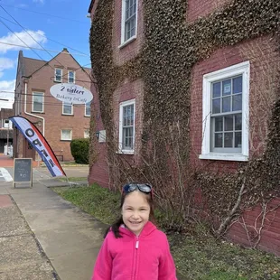 My daughter outside the bakery and cafe