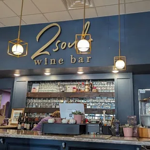 a bar with a couple of people