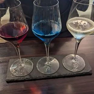 three glasses of wine on a table