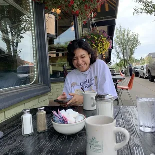 Outdoor dining in the morning with my partner. The flowers outside are always happy and colorful!