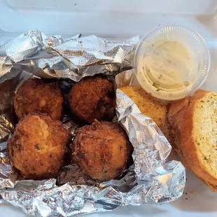 a container with bread and dip